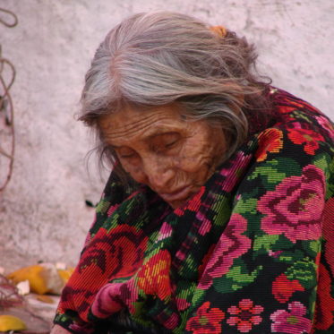 an old mayan woman at chichicastenango